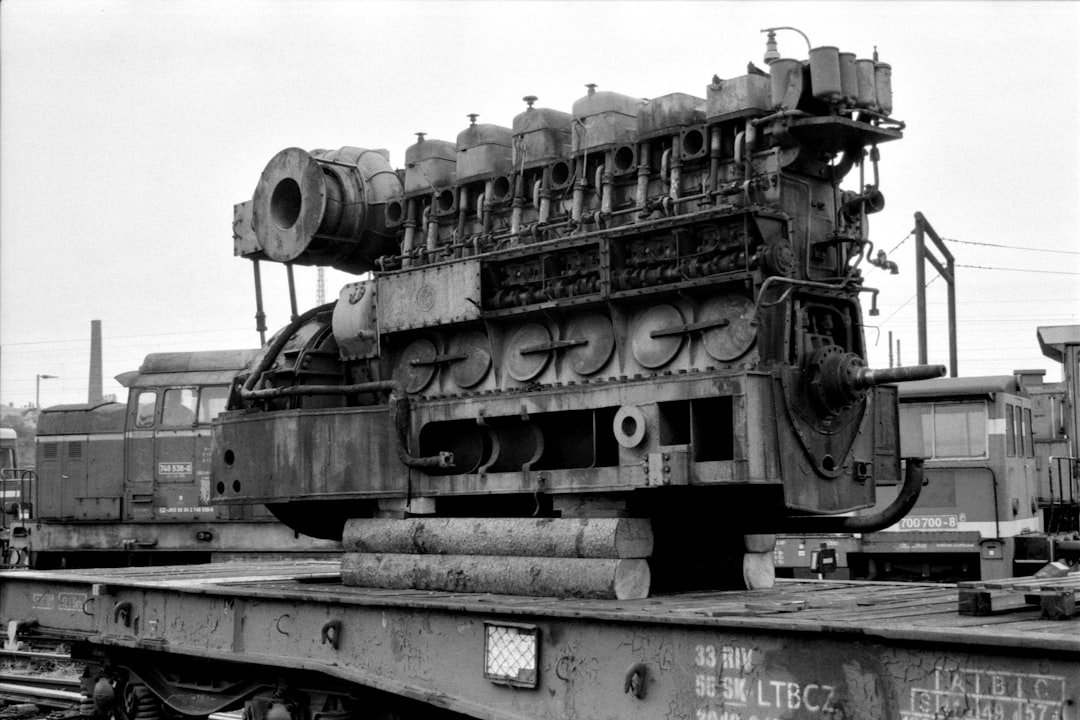 an-old-train-engine-sitting-on-top-of-a-train-track-urlfyq5ced4